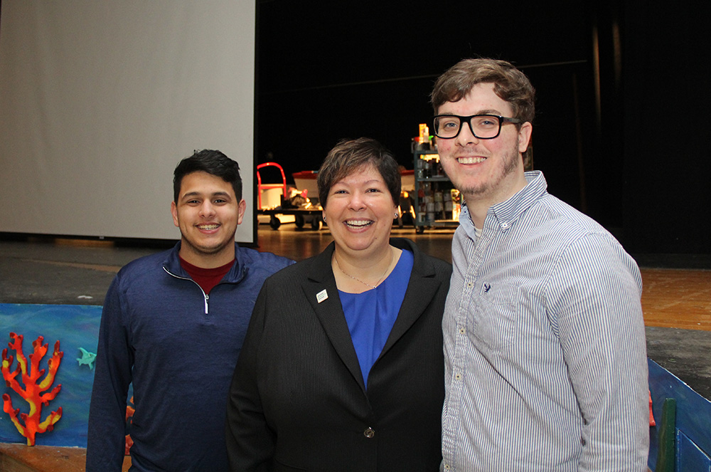 HCC president Christina Royal with two students